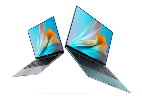 2 opposite facing laptop computers, 1 in gray and the other one in green